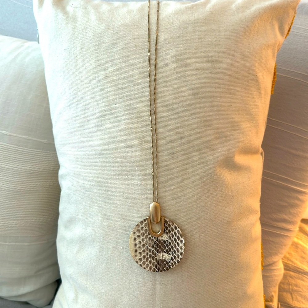 Necklace is in good condition and is 18” in length